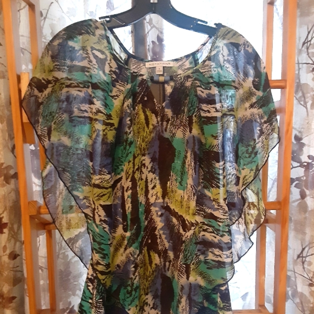 Beautiful top manufactured by Notations.